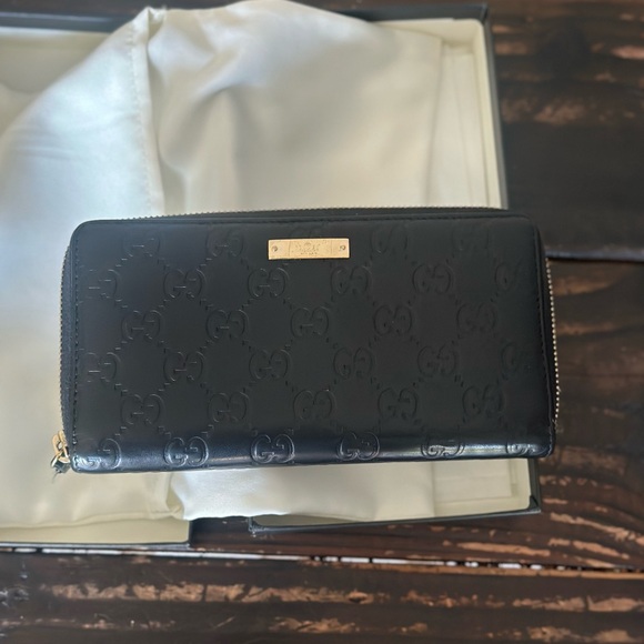 Gucci Black Embossed GG Zip Wallet with Gold Plaque